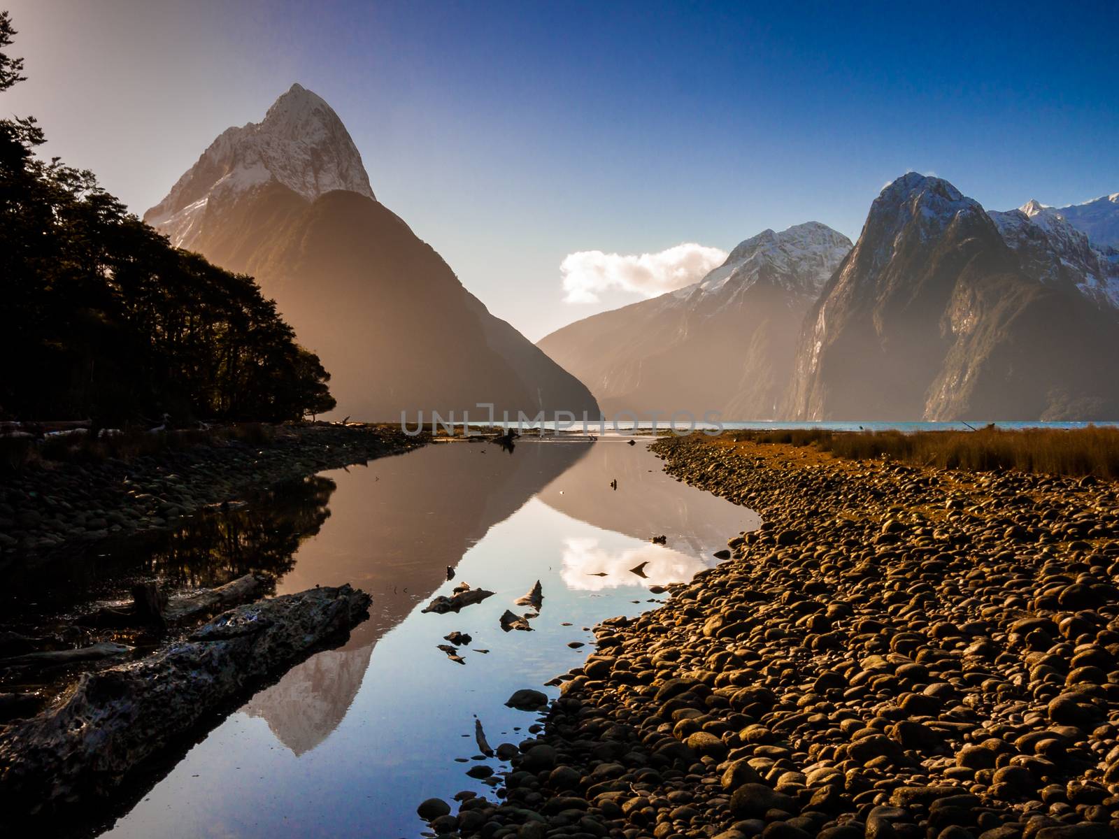 Snow caped mountains reflecting in a lake