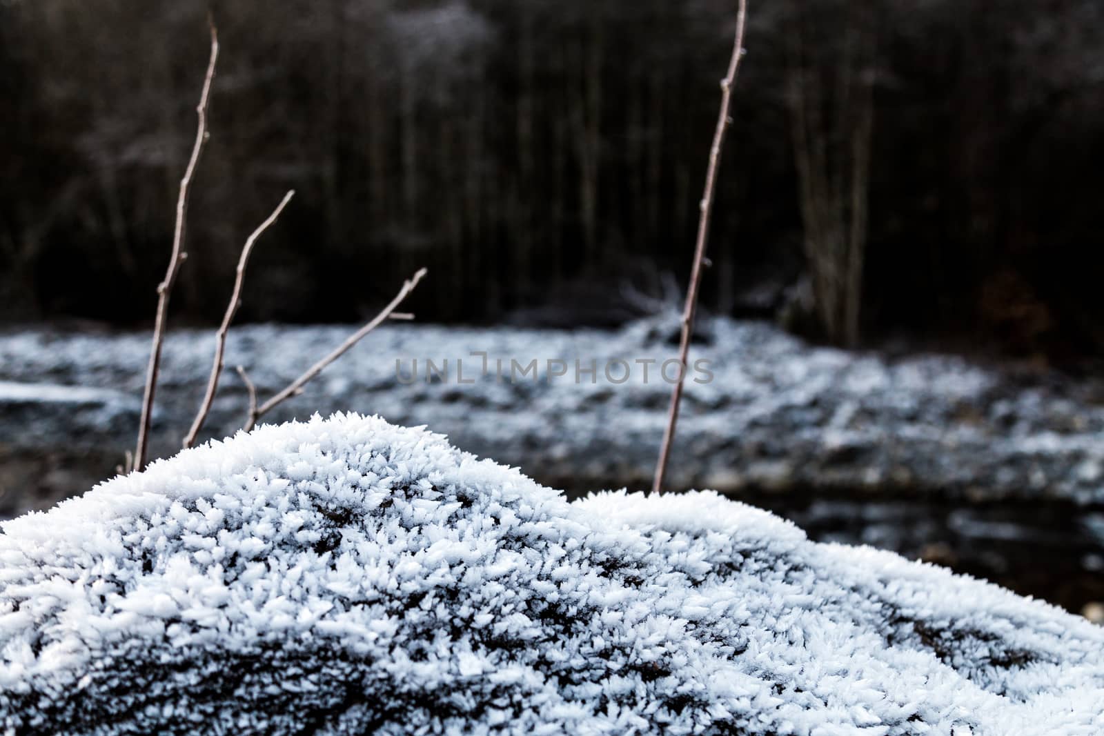 Frozen rocks with frost over them