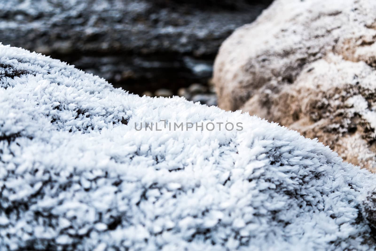 Frozen rocks with frost over them