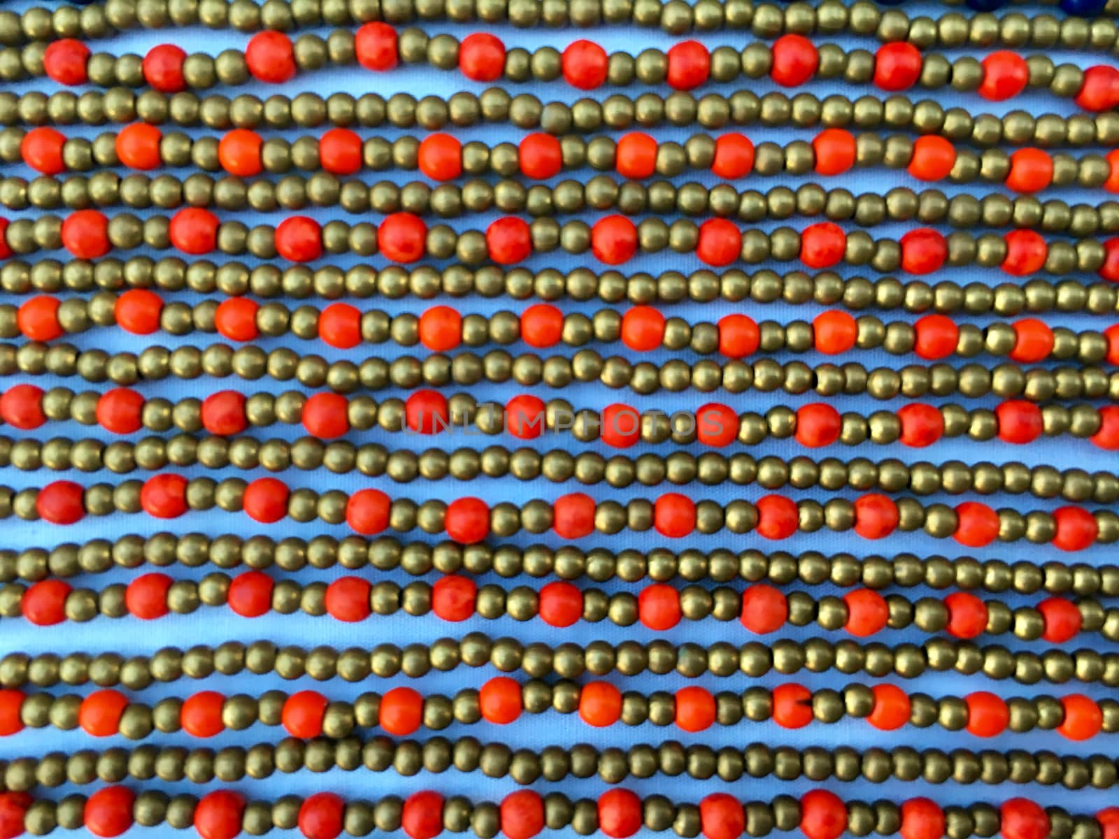 Bijouterie fashion background. Closeup of jewelry bracelets in a row.