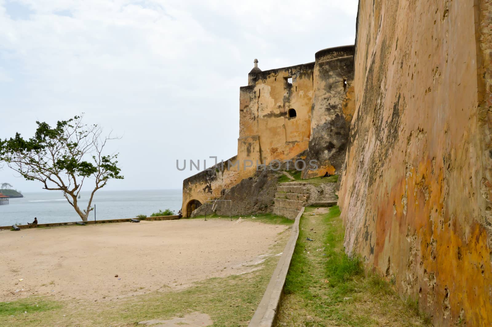 Surrounding wall of the fortress of Mombasa in Kenya with black  by Philou1000