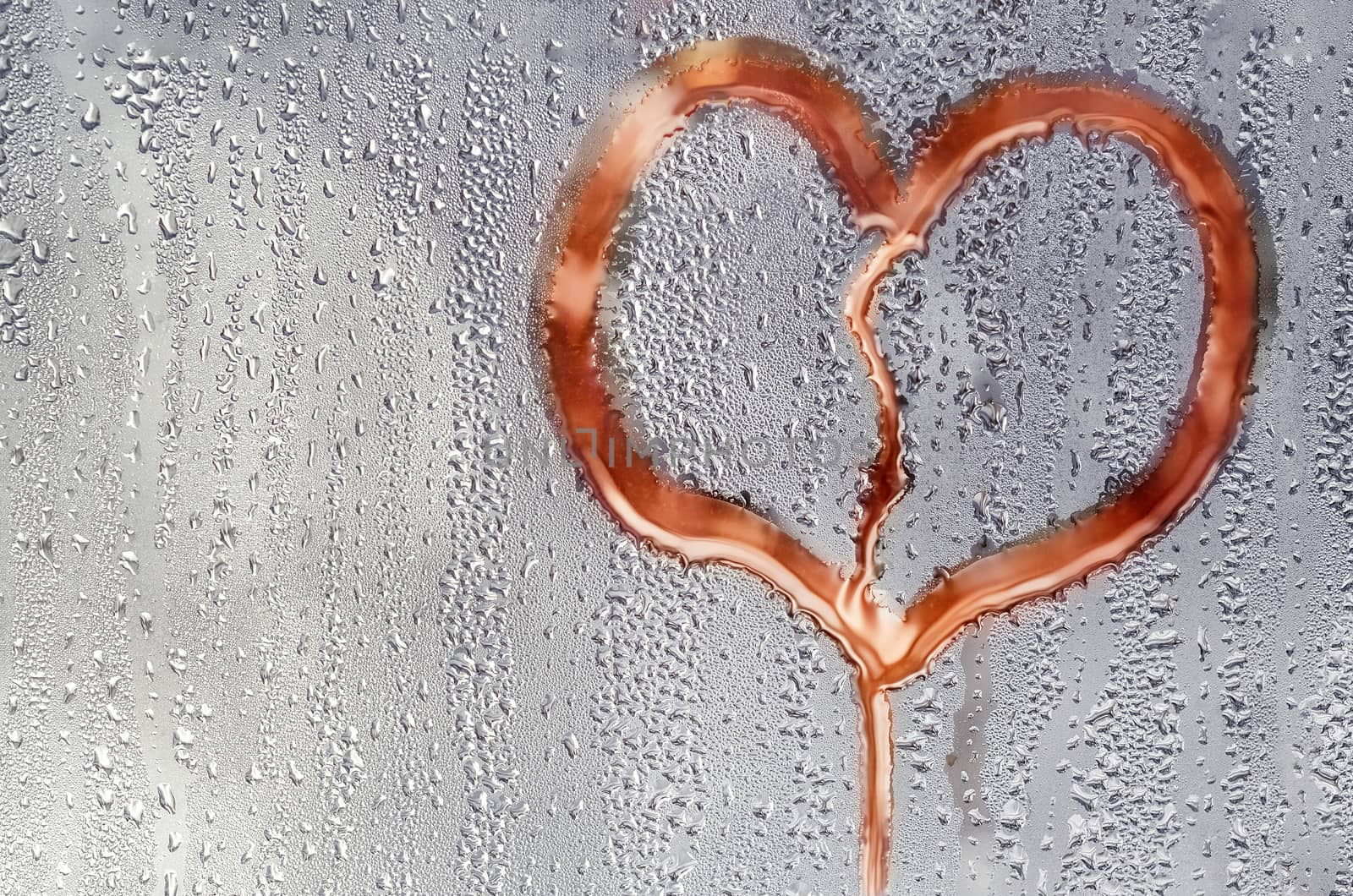 Textured background with drops on glass and painted heart.