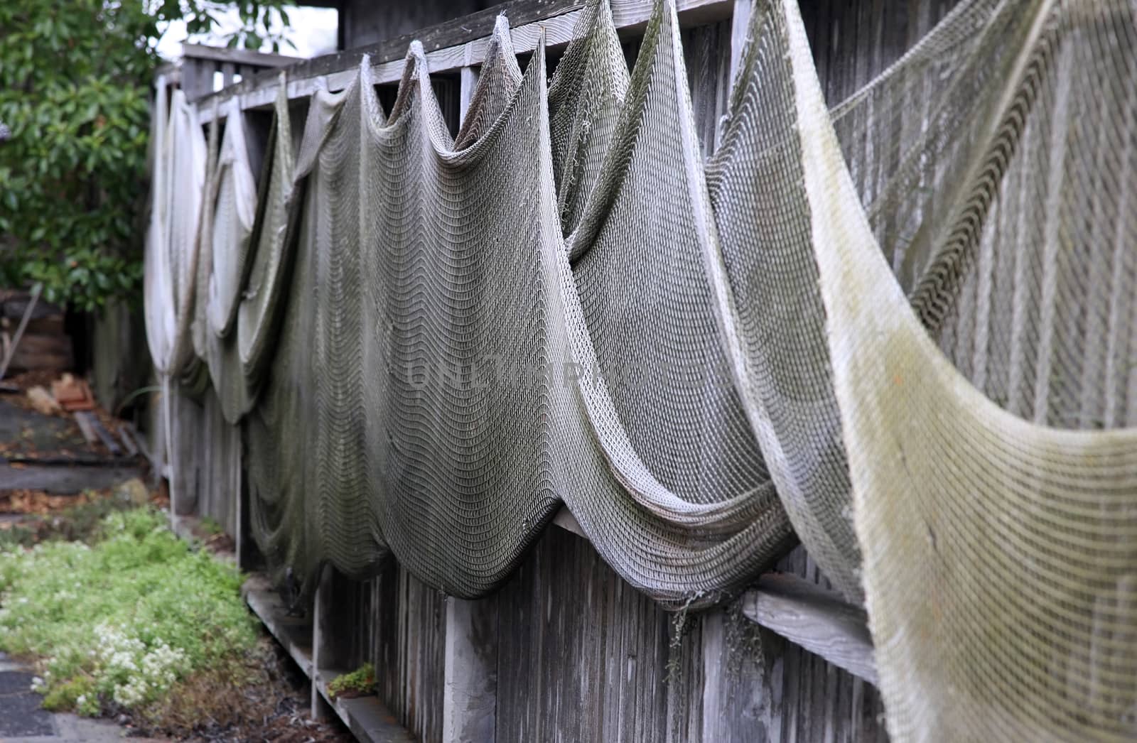 Fishing nets drying on the fence