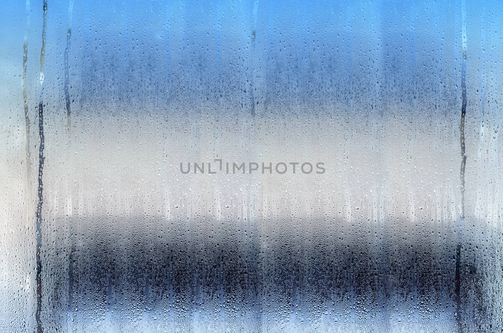 Tricolor texture background with drops on the glass. Plenty of space for text.