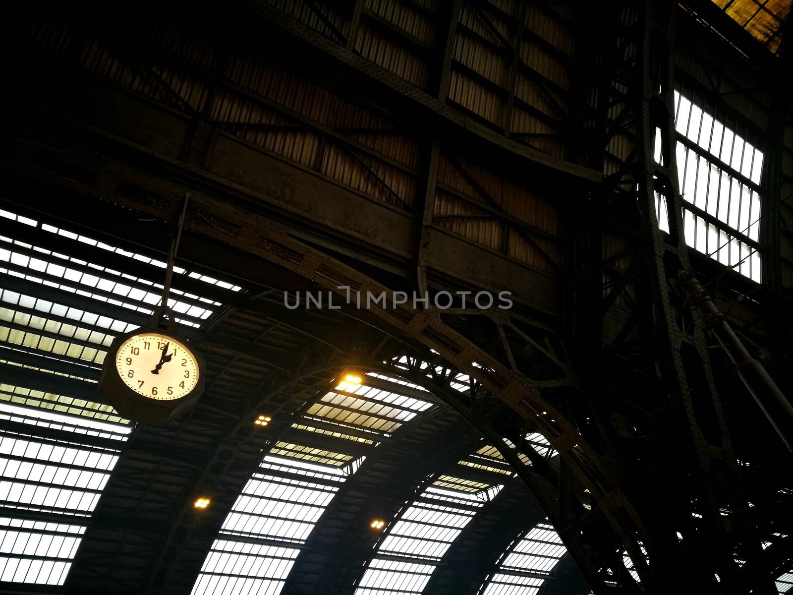 Architectural detail in Milan Central Station in Milan, Italy. Low angle view with dark shades and natural light from top.