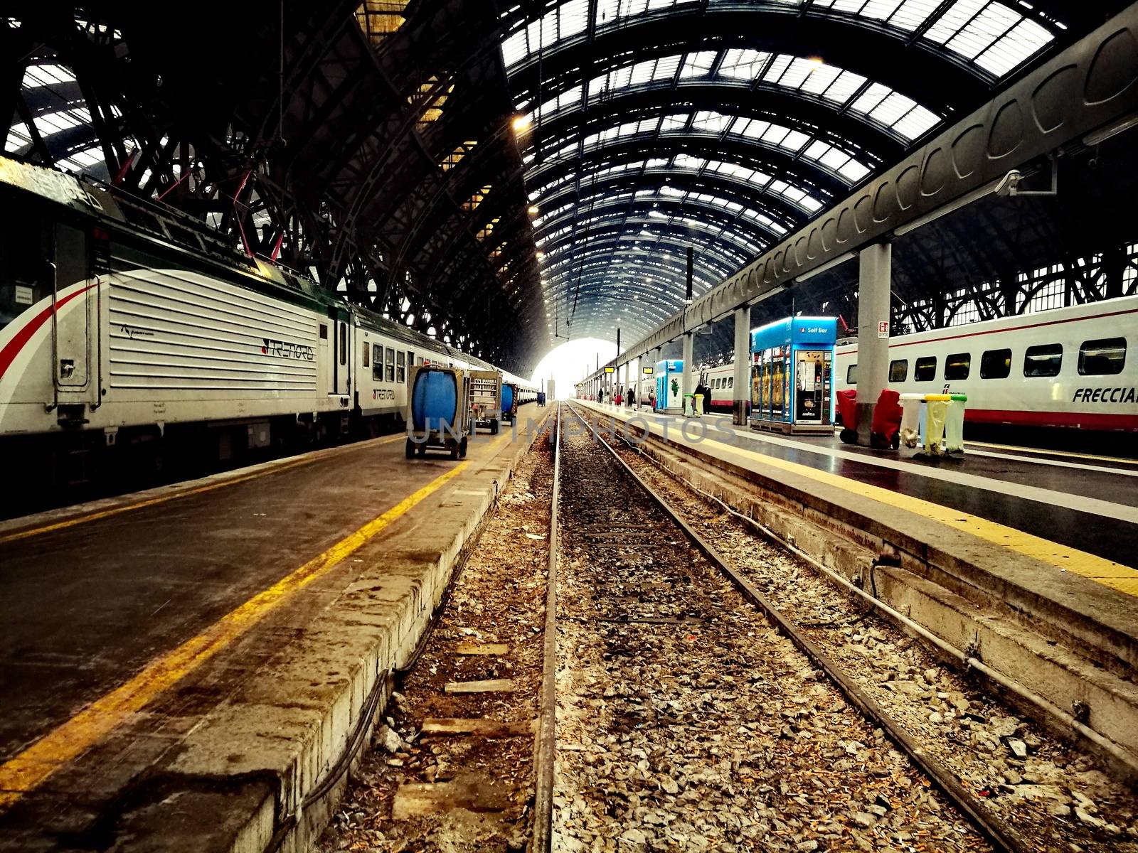 Architectural detail in Milan Central Station in Milan, Italy. Low angle view with dark shades and natural light from top.