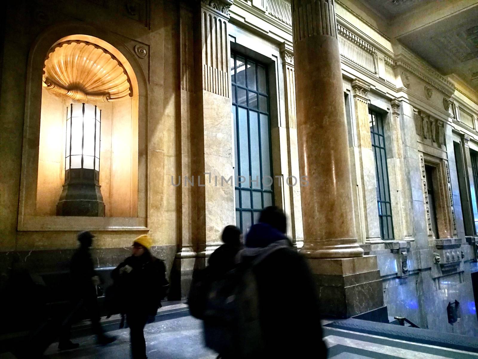 Architectural detail in Milan Central Station in Milan, Italy. Low angle view with dark shades and natural light from top.