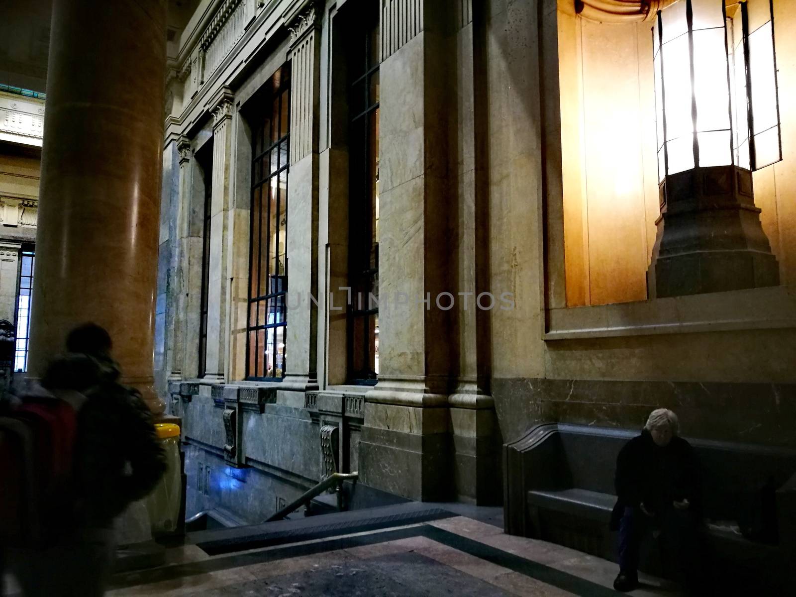 Architectural detail in Milan Central Station in Milan, Italy. Low angle view with dark shades and natural light from top.