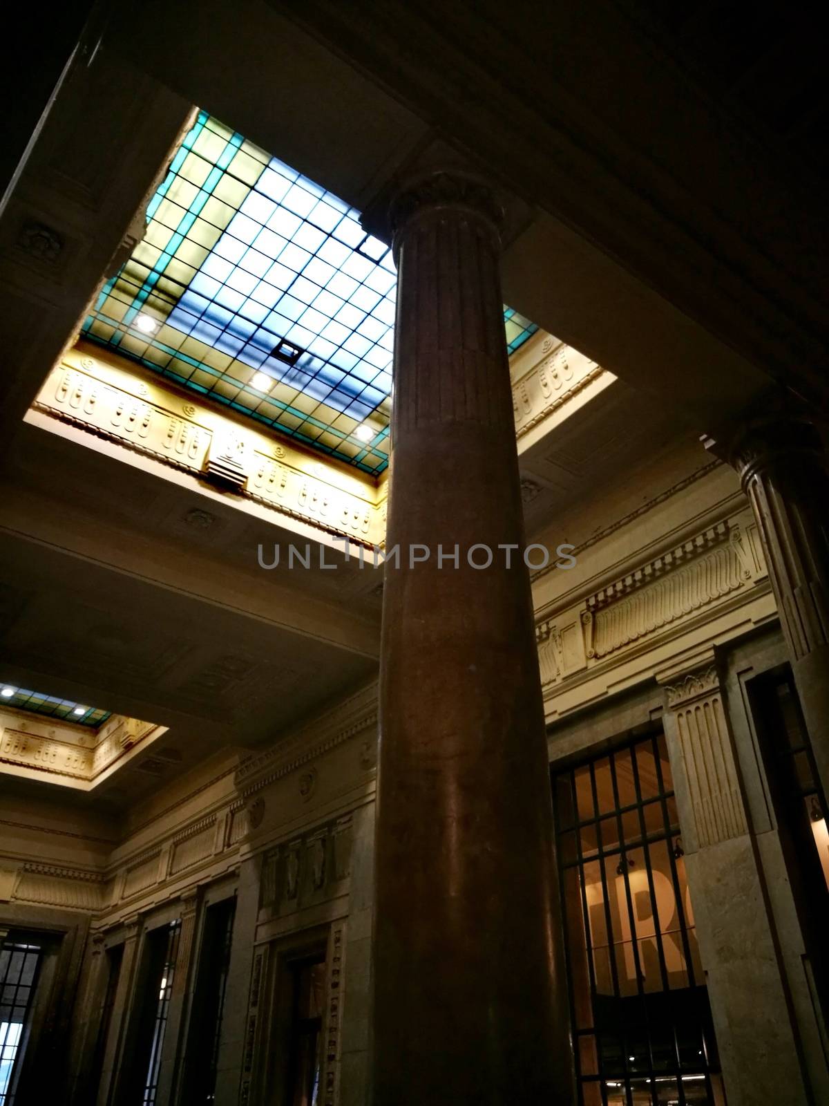 Architectural detail in Milan Central Station in Milan, Italy. Low angle view with dark shades and natural light from top.