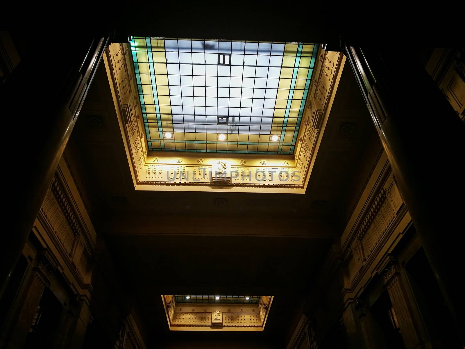 Architectural detail in Milan Central Station in Milan, Italy. Low angle view with dark shades and natural light from top.