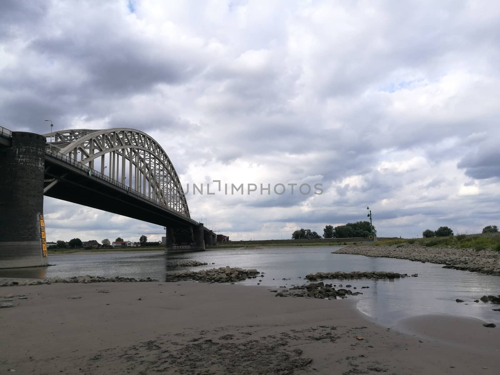 Main bridge over the channel in Nijmegen, Netherlans under a dramatic sky