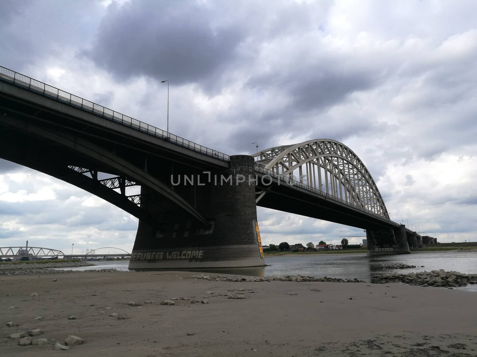 Main bridge over the channel in Nijmegen, Netherlans under a dramatic sky