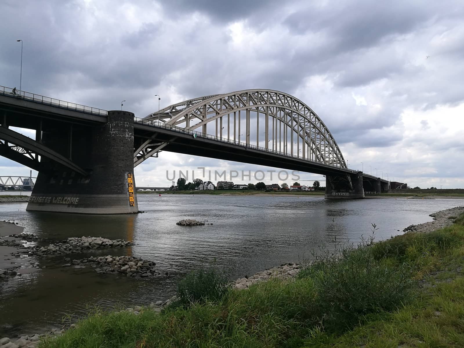 Main bridge over the channel in Nijmegen, Netherlans under a dramatic sky