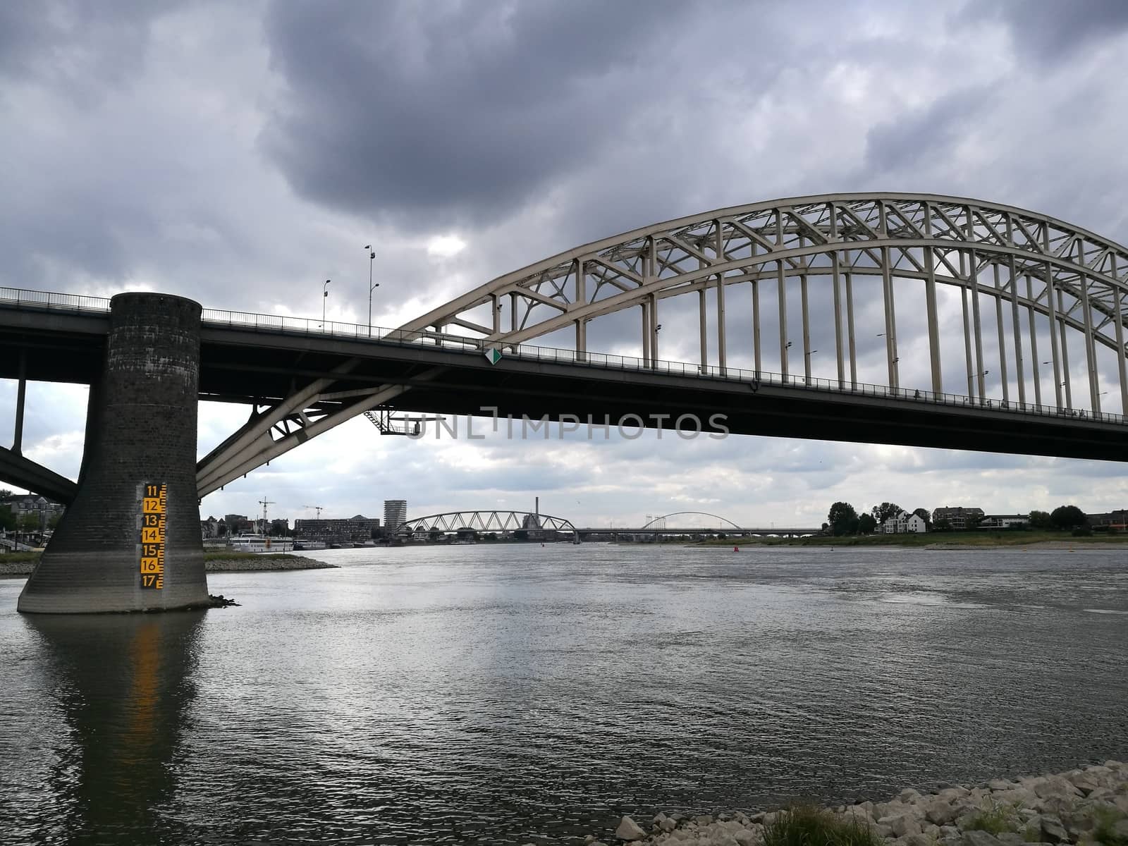 Main bridge over the channel in Nijmegen, Netherlans under a dramatic sky