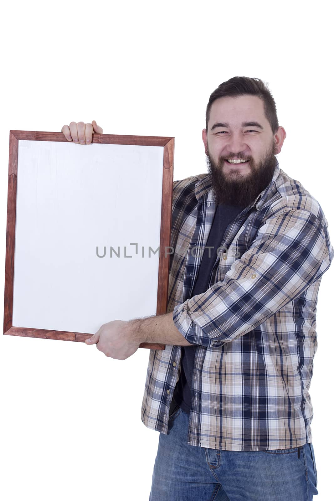 Happy smiling bearded man in a plaid shirt holds a board for records