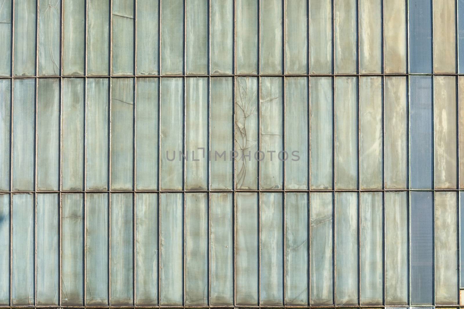 Silver-colored metal wall corrugated sheet metal background.