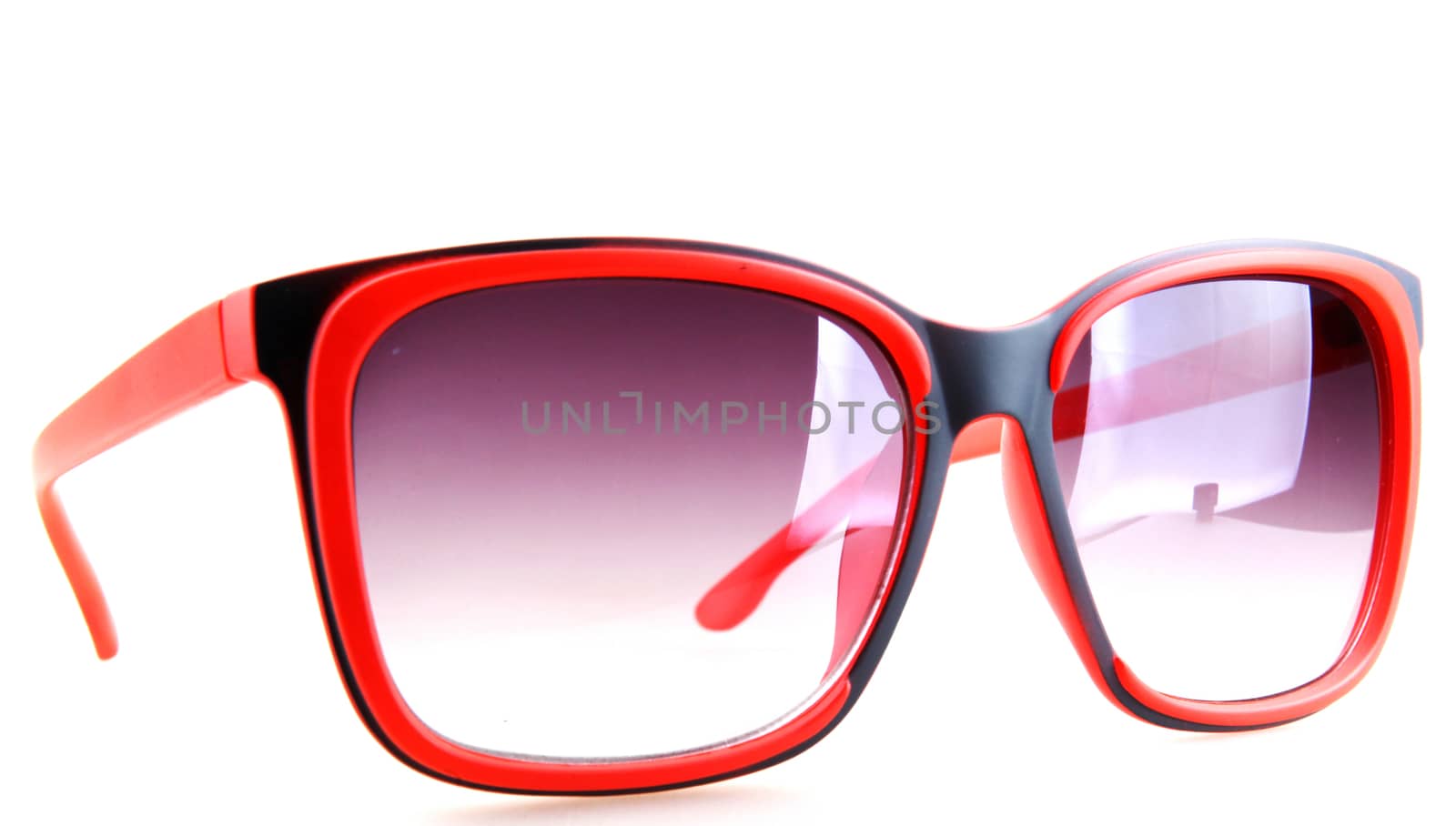 Pink sunglasses isolated on white.
