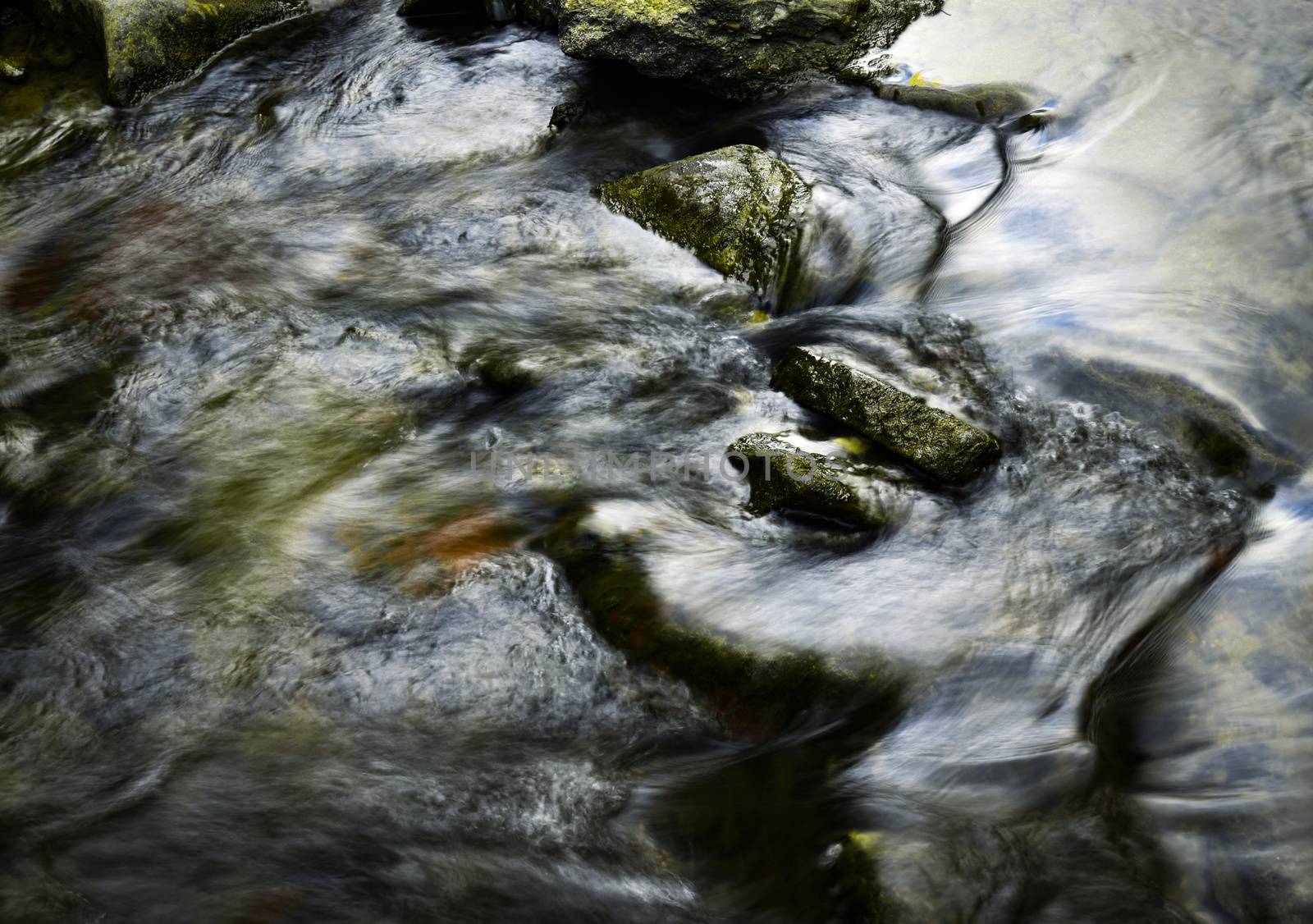 abstract background autumn dark detail river with rocks