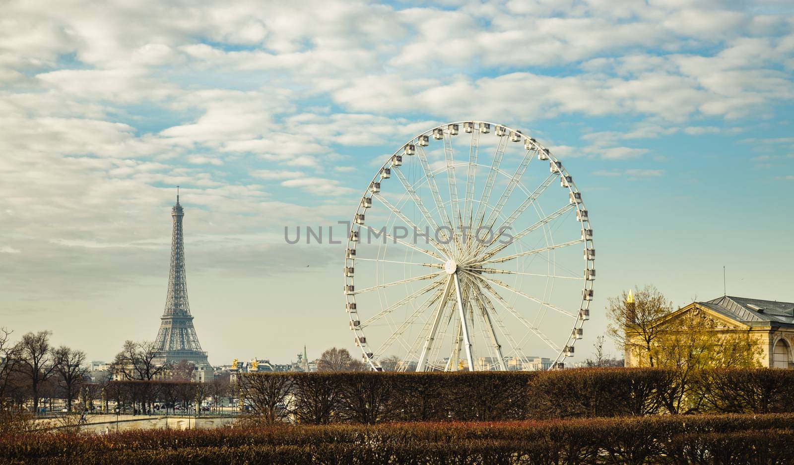 The ferris wheel and the Eiffel Tower in Paris, France