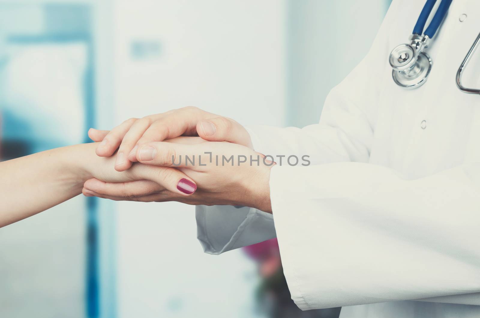 Doctor holding patient hand close up by simpson33