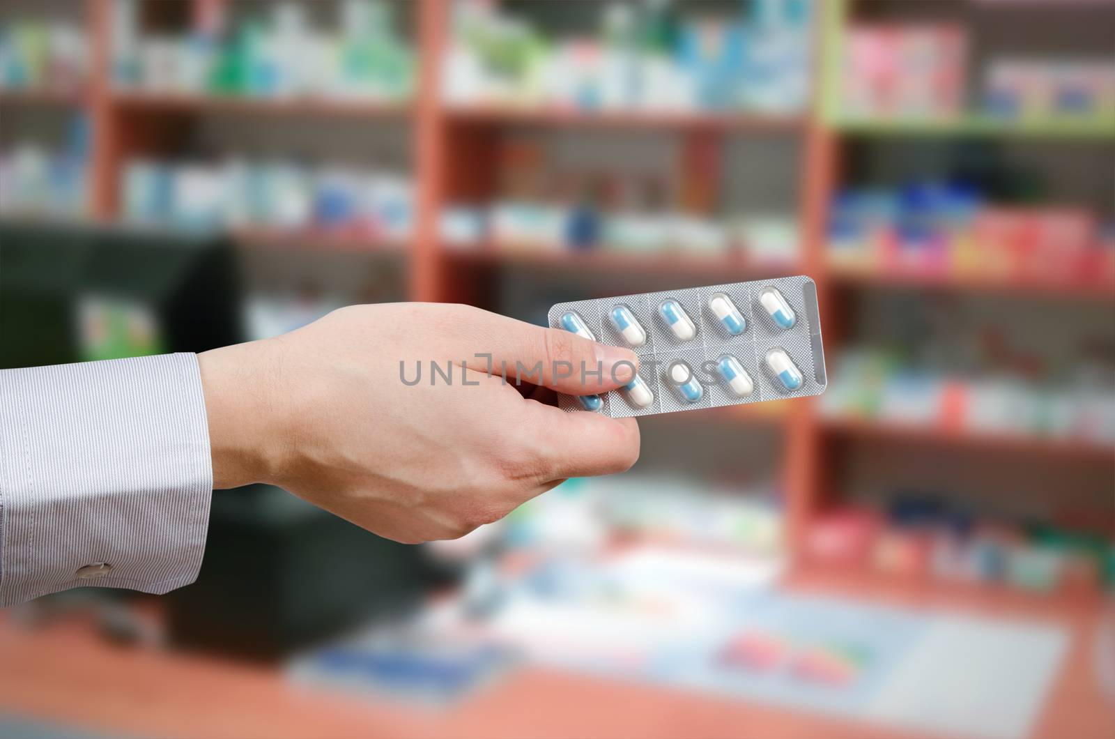 Pharmacist holding tablets in hands. pills medicine pharmacy hand holding drugs buy health concept