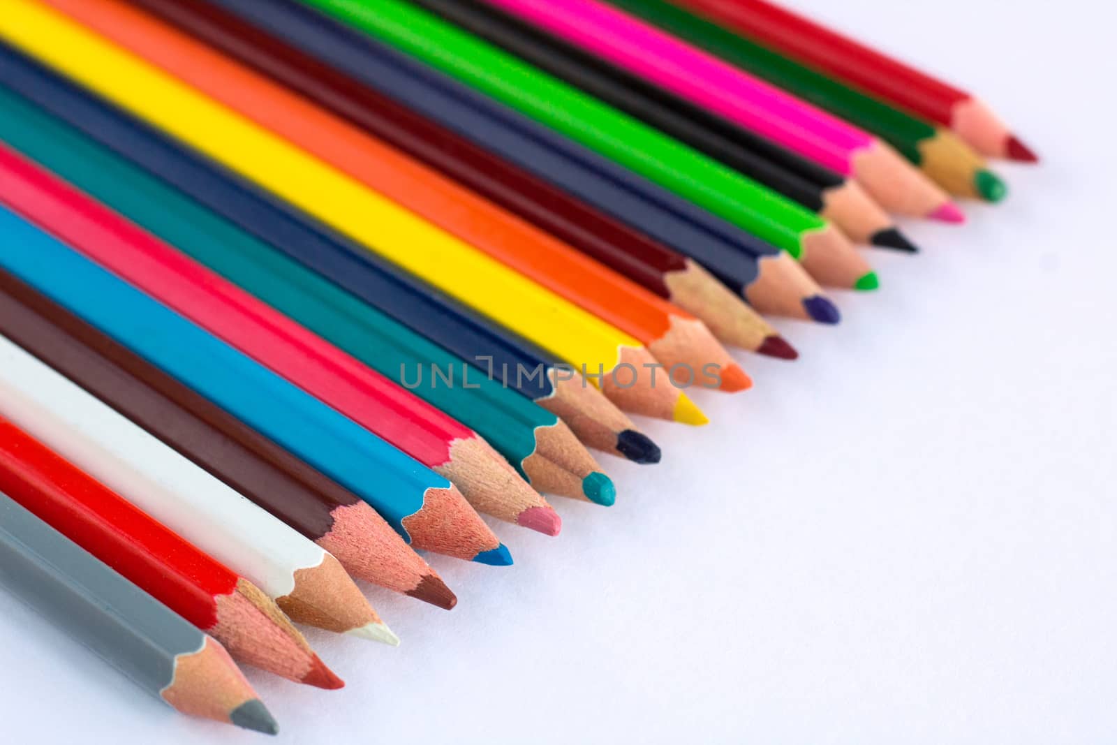 White background for presentation slide with colourful wooden pencils