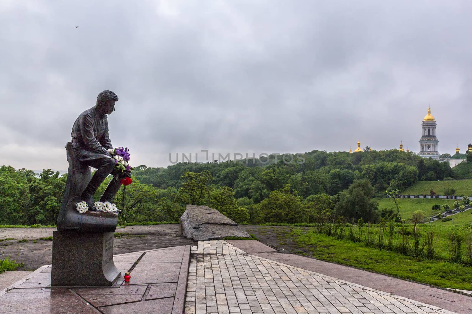 Monument to the military pilots (World War II) with a statue of famous soviet actor Leonid Bykov in Pechersk (Kiev, Ukraine).
Kiev Pechersk Lavra is on the background.