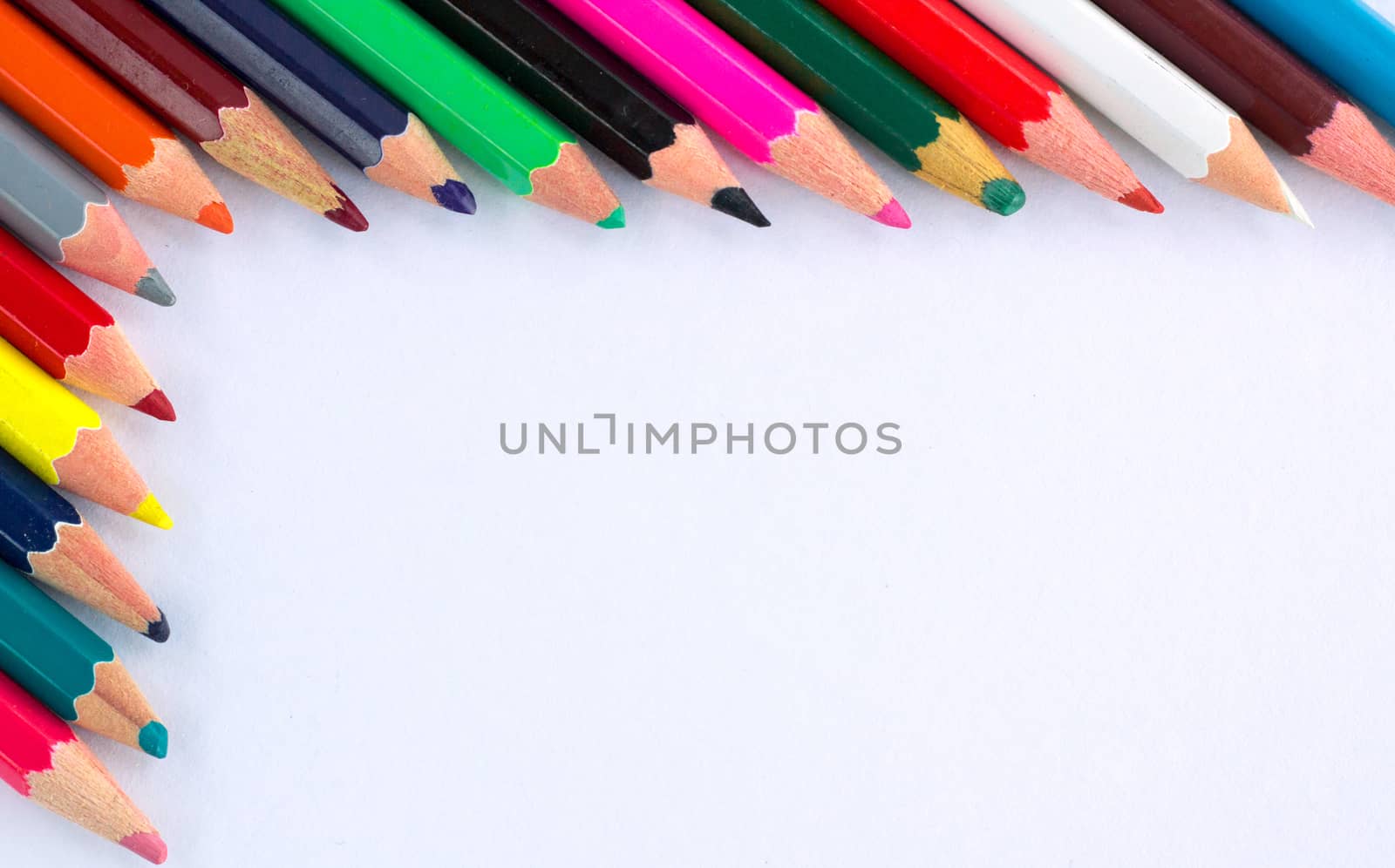 White background for presentation with colourful right upper corner border of multicoloured wooden pencils