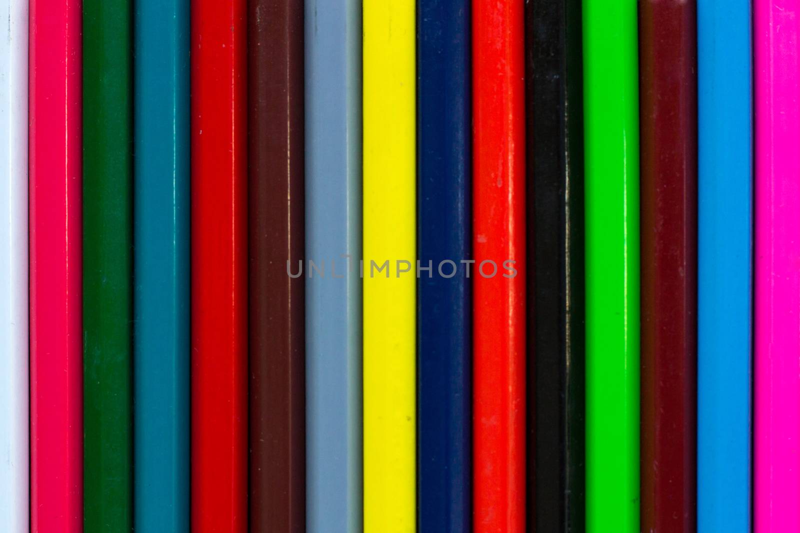 Vertical colourful stripes of multicoloured wooden pencils background background for presentations