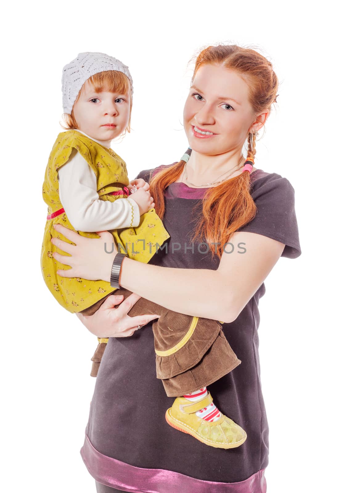 Mother holding daughter standing isolated on white