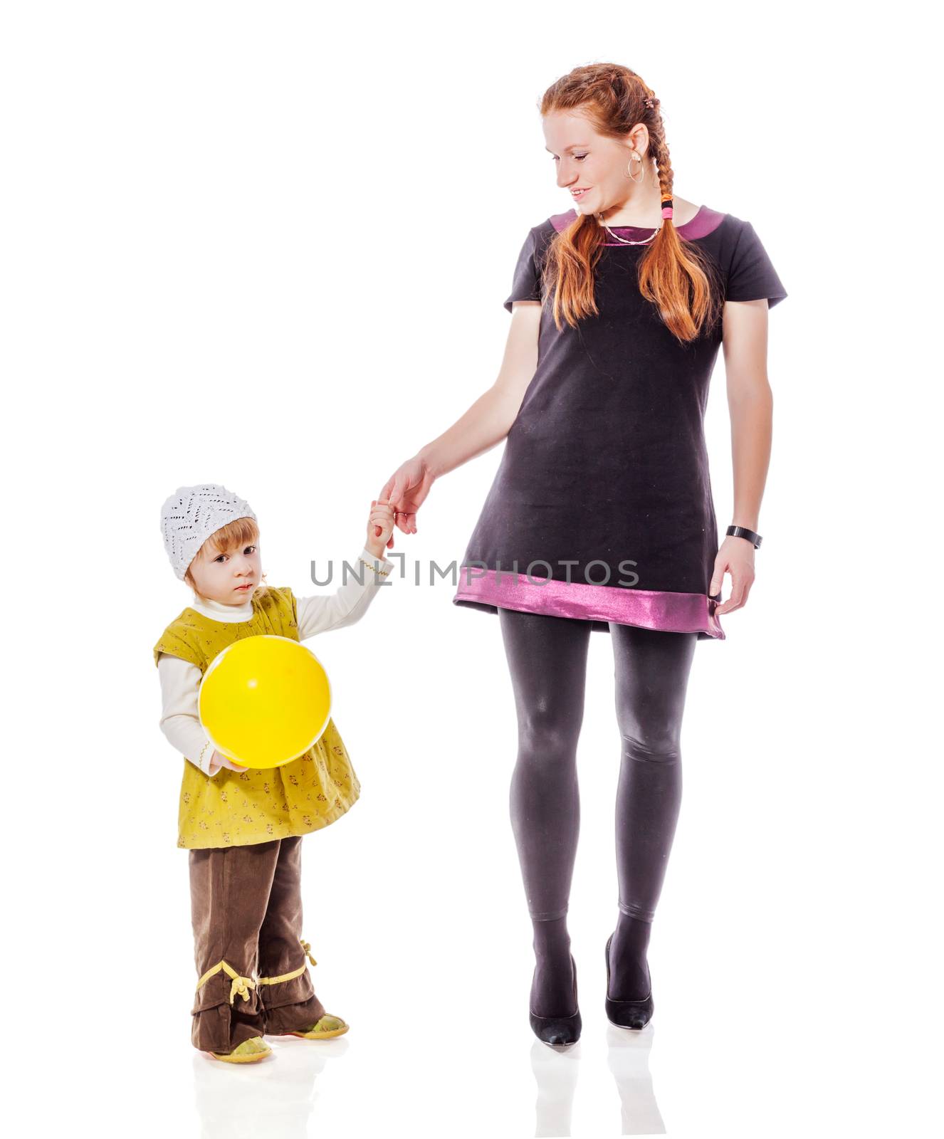Mother walking with two years daughter isolated on white