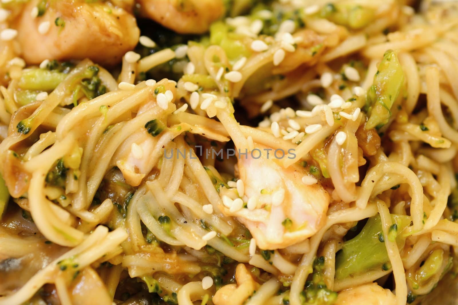 Chinese noodles with chicken meat, broccoli and vegetables.