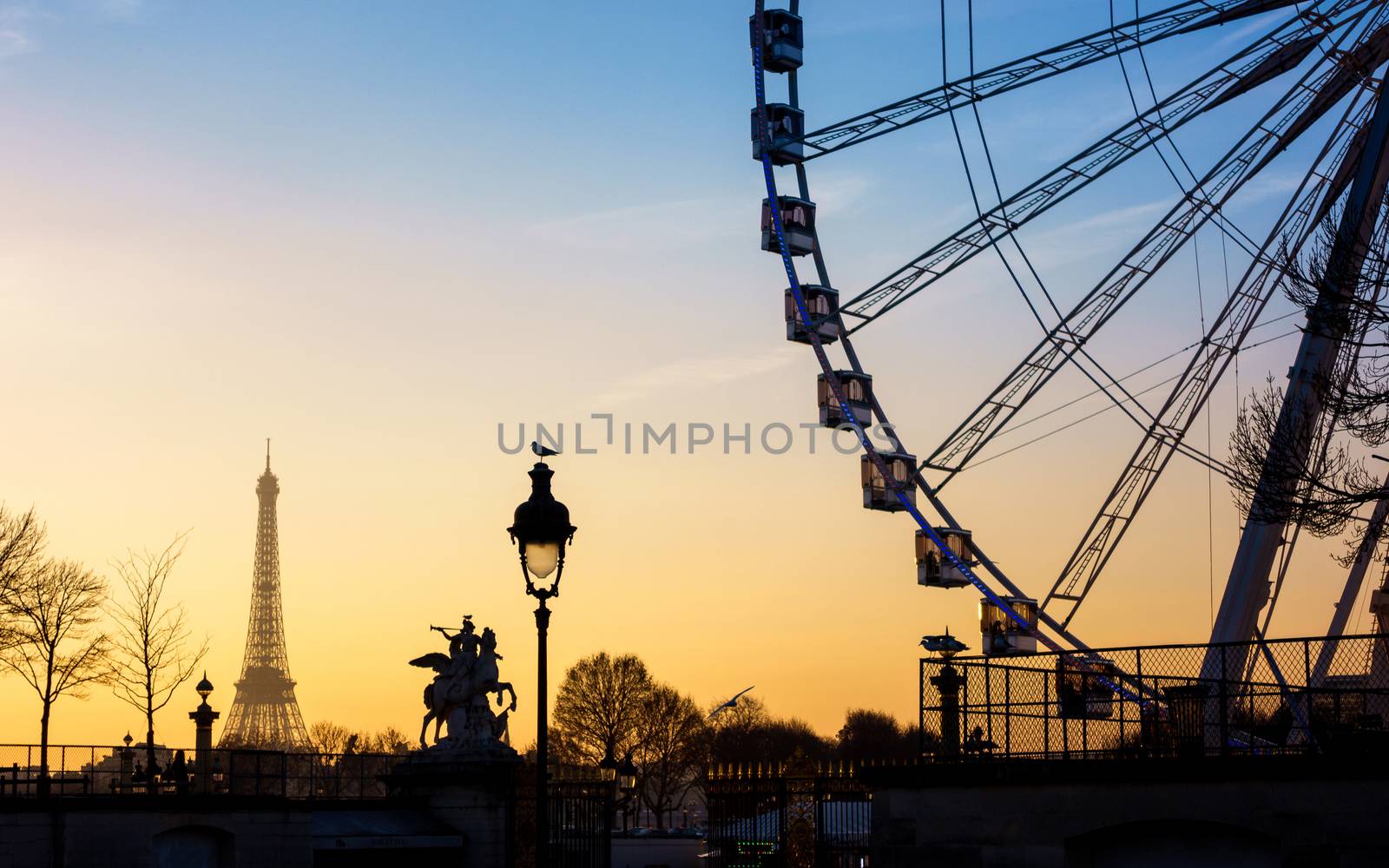 The ferris wheel and the Eiffel Tower in Paris, France