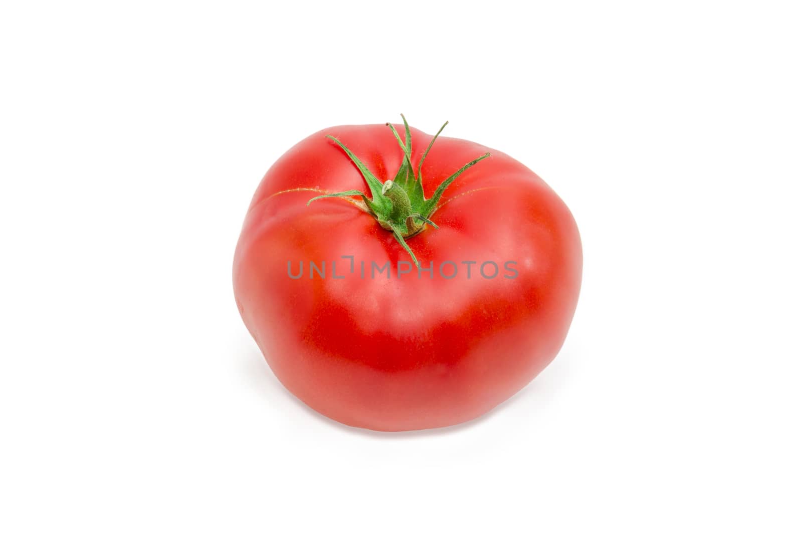 One ripe red tomato closeup on a light background
