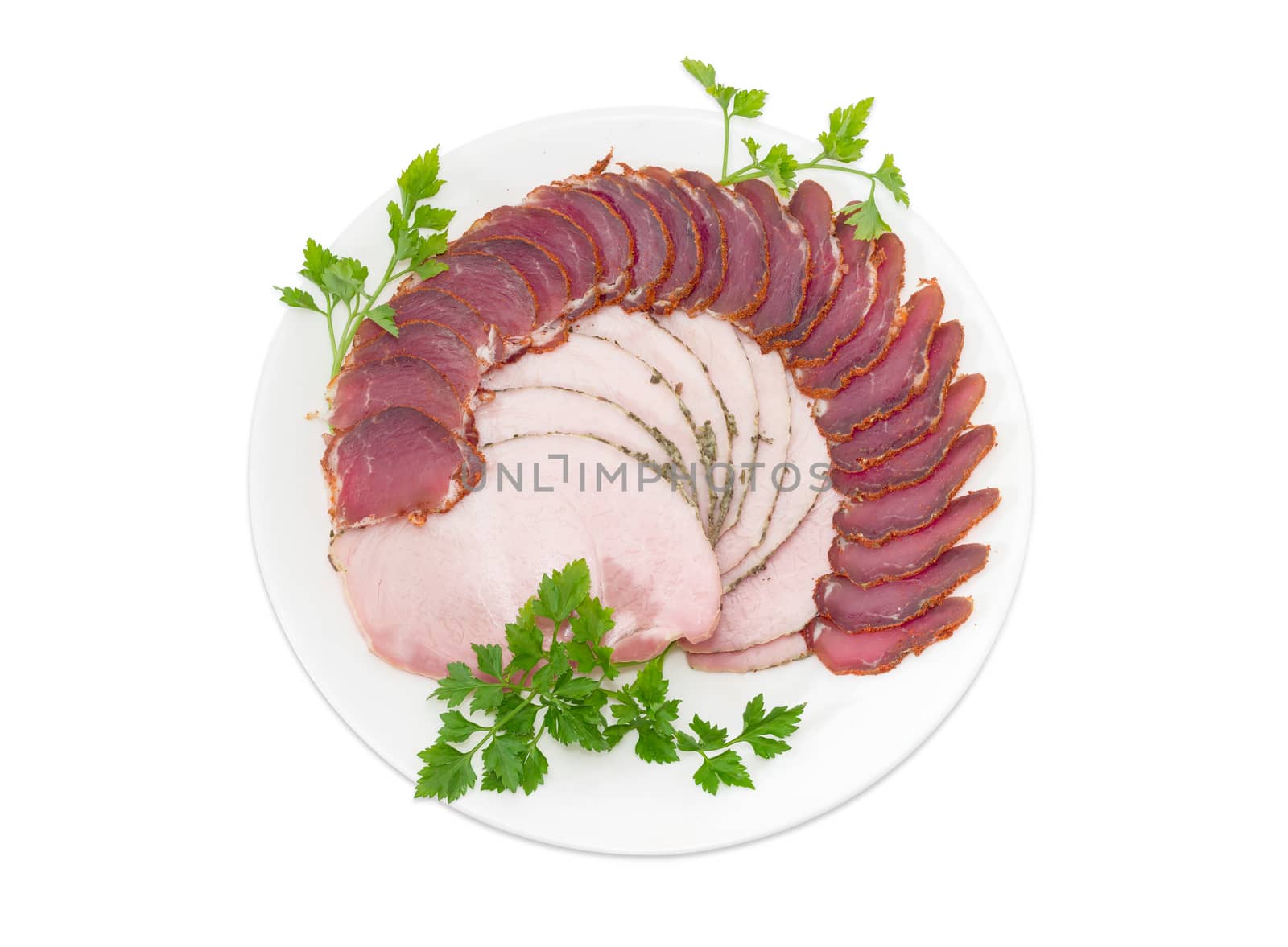 Sliced dried pork tenderloin and ham with parsley twigs by anmbph