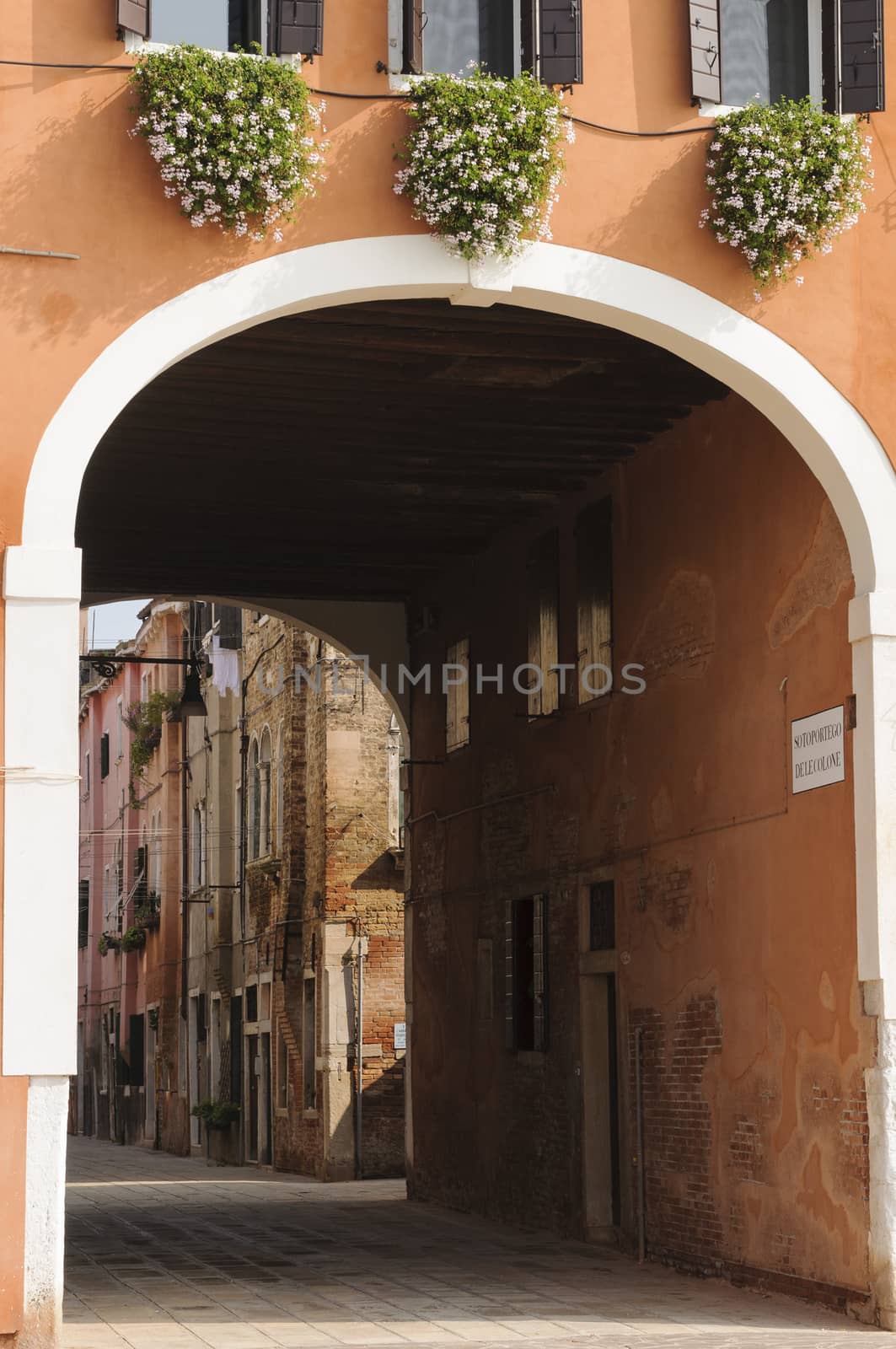 Narrow cobblestone alley in the historical centre of Venice, Veneto, Italy, Europe