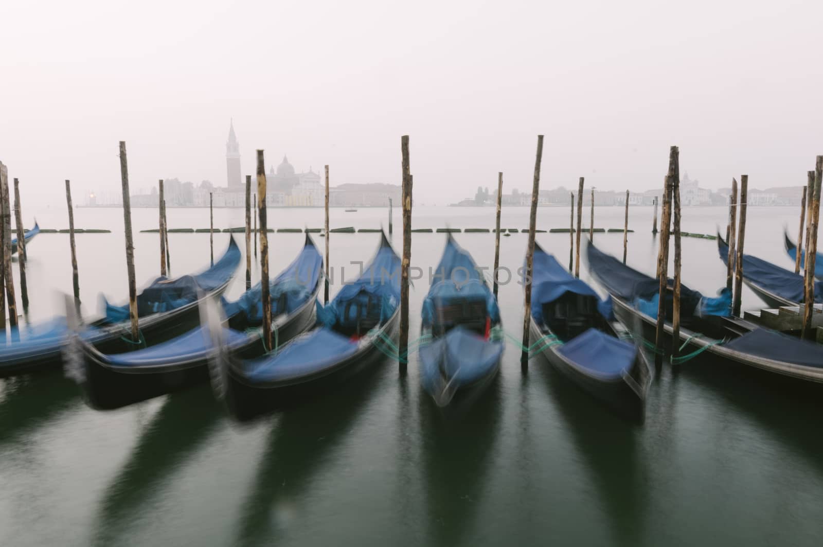 Gondolas at their moorings in Venice, Veneto, Italy, Europe by ale_rizzo