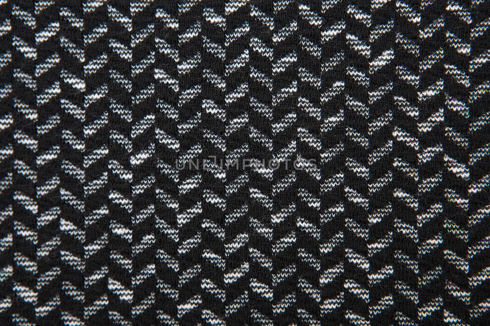 Black and white herringbone fabric pattern texture background closeup