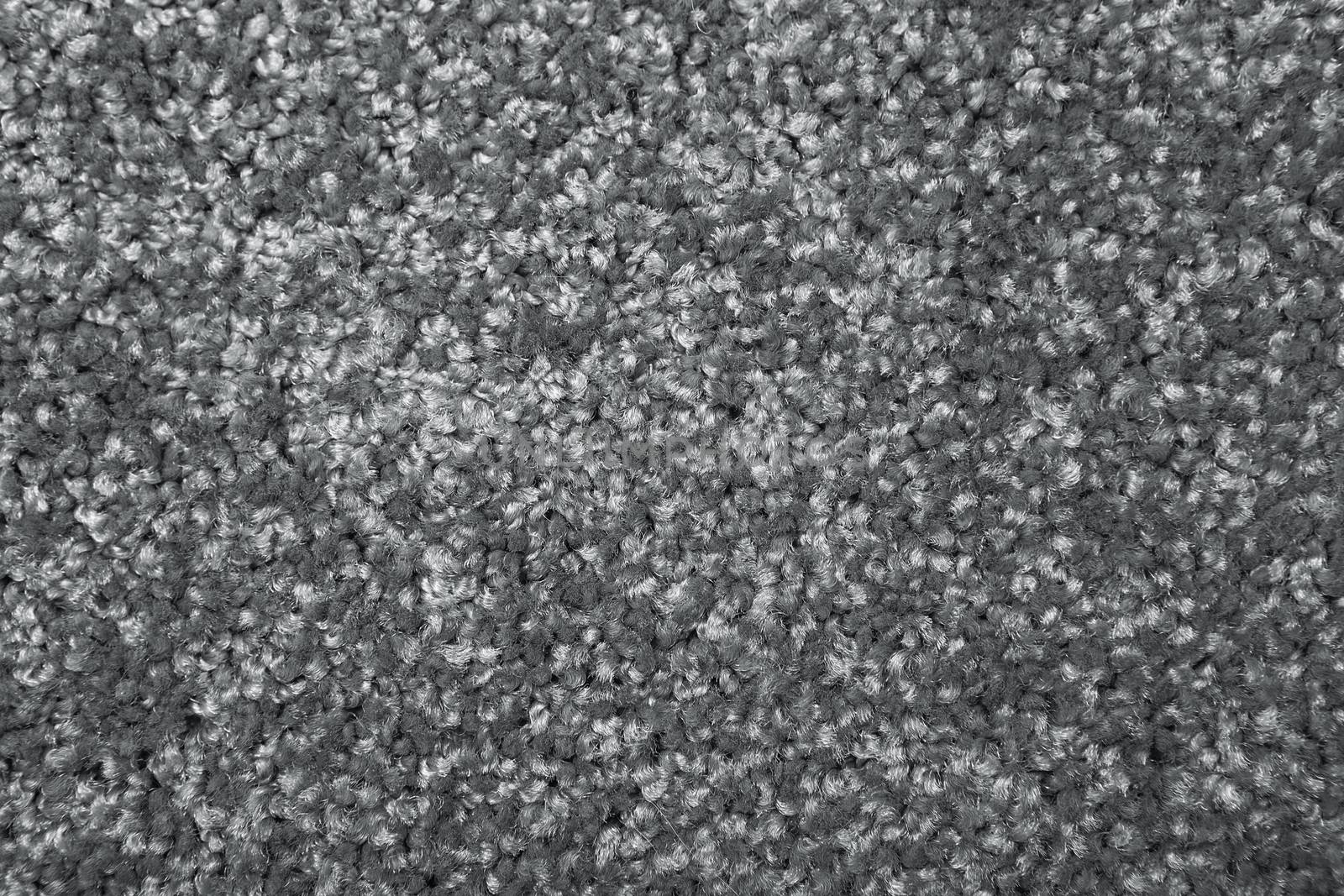 Macro shot of a carpeting texture background. Gray Textile floor covering. Grey Knotted-pile carpet