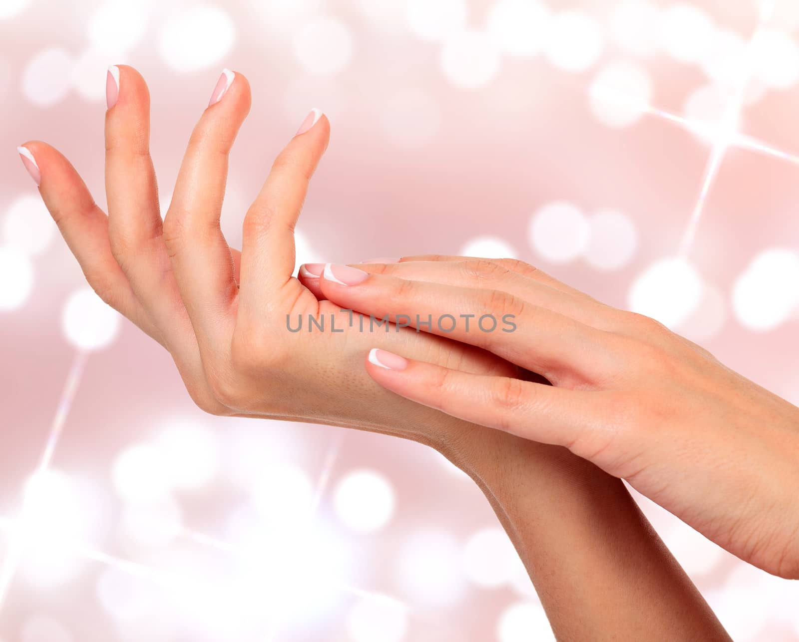 Beautiful woman hands against an abstract background by Nobilior