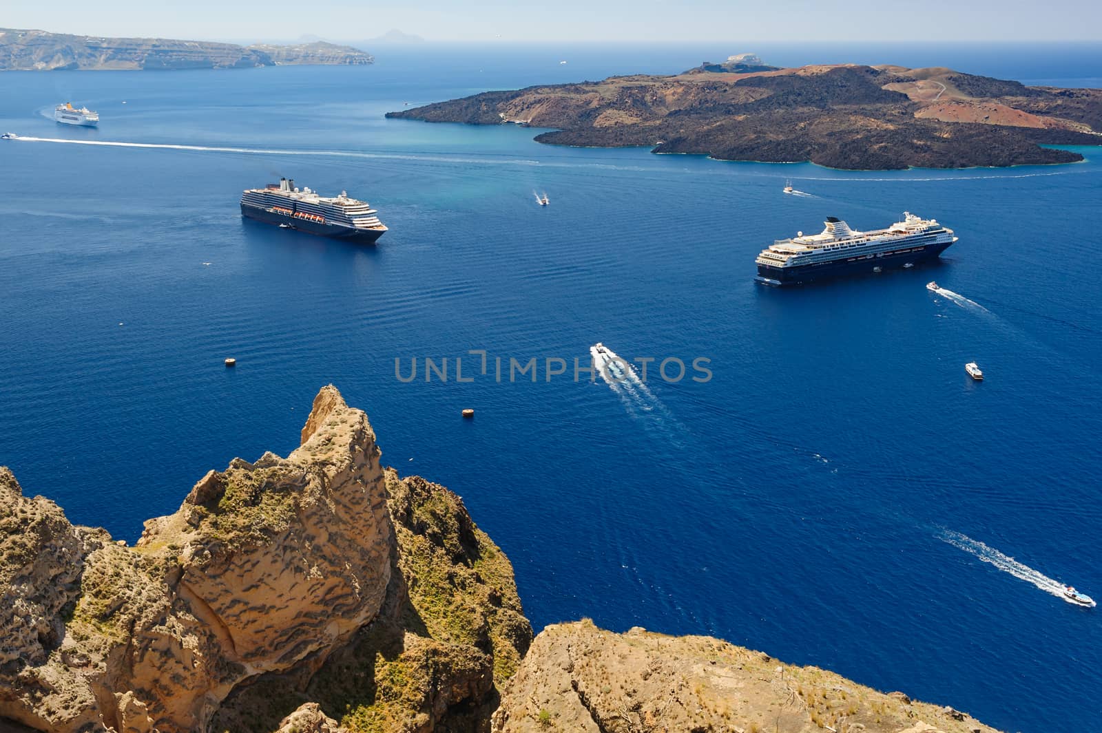 View from Fira coast to caldera sea with ships at background, Santorini Greece. Copyspace