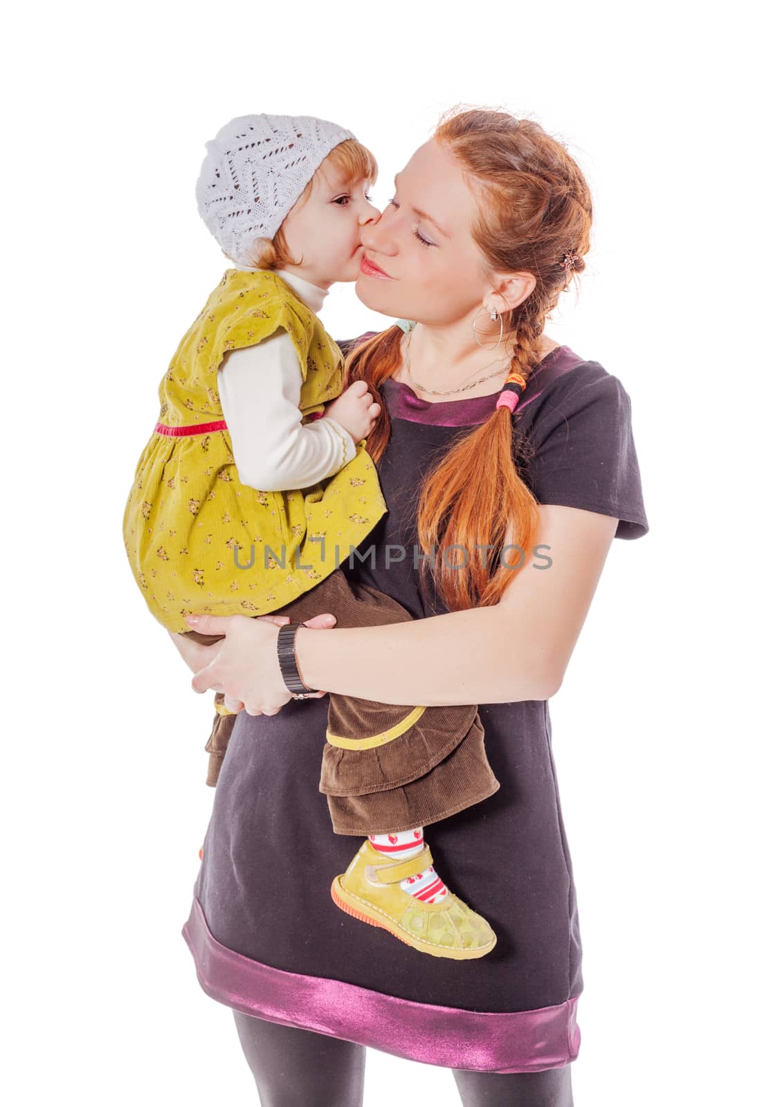 Two years daughter kissing mother isolated on white