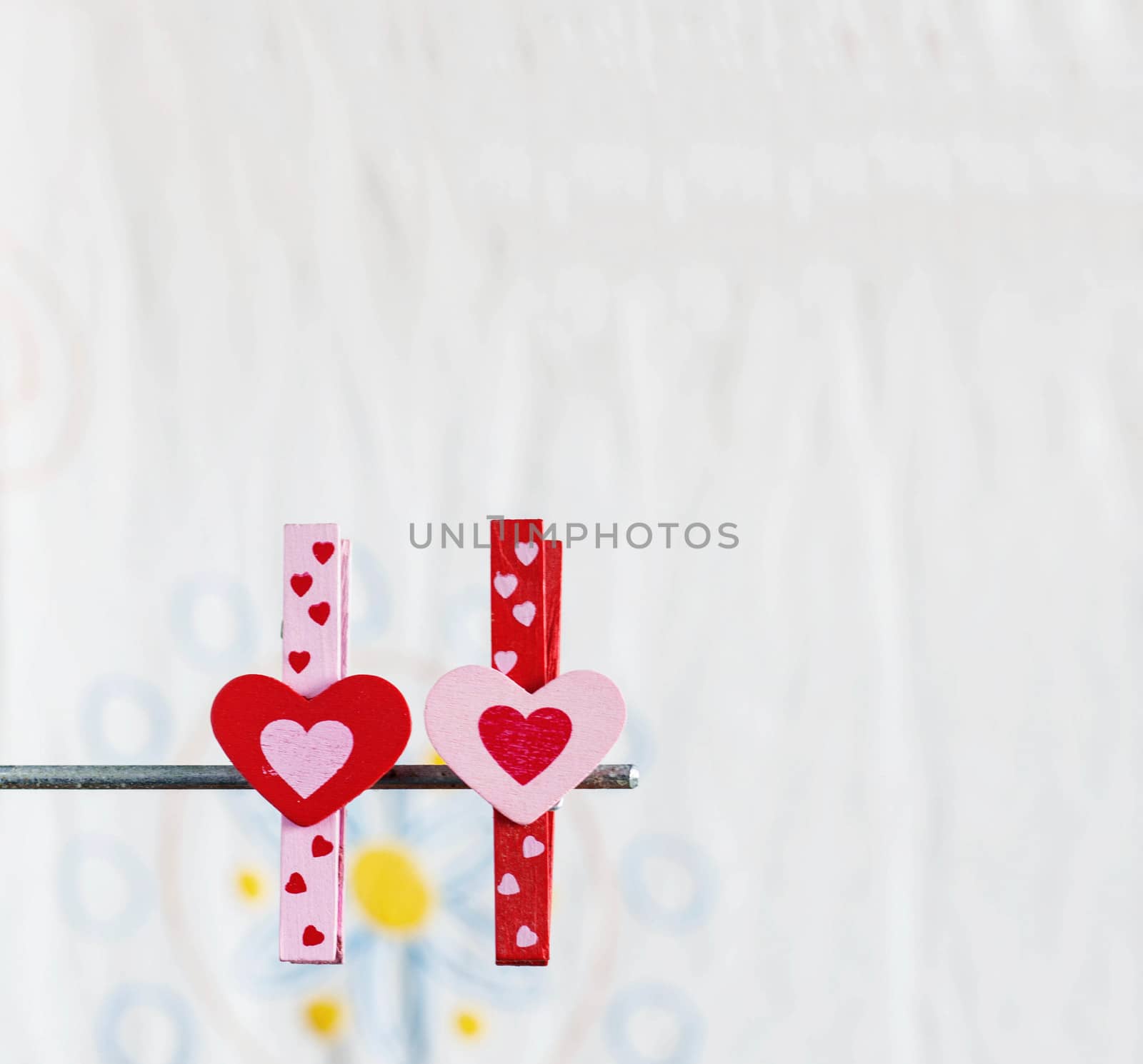 Colorful heart of pin with a white background.