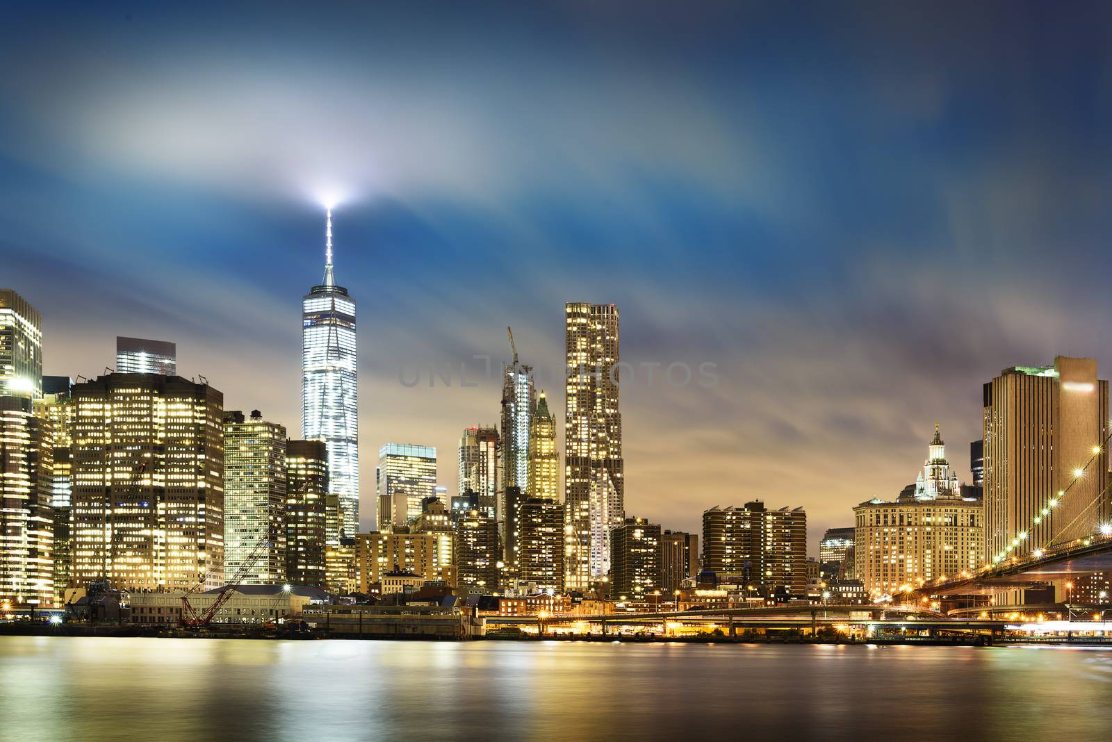 New York City - beautiful sunrise over manhattan with manhattan and brooklyn bridge USA