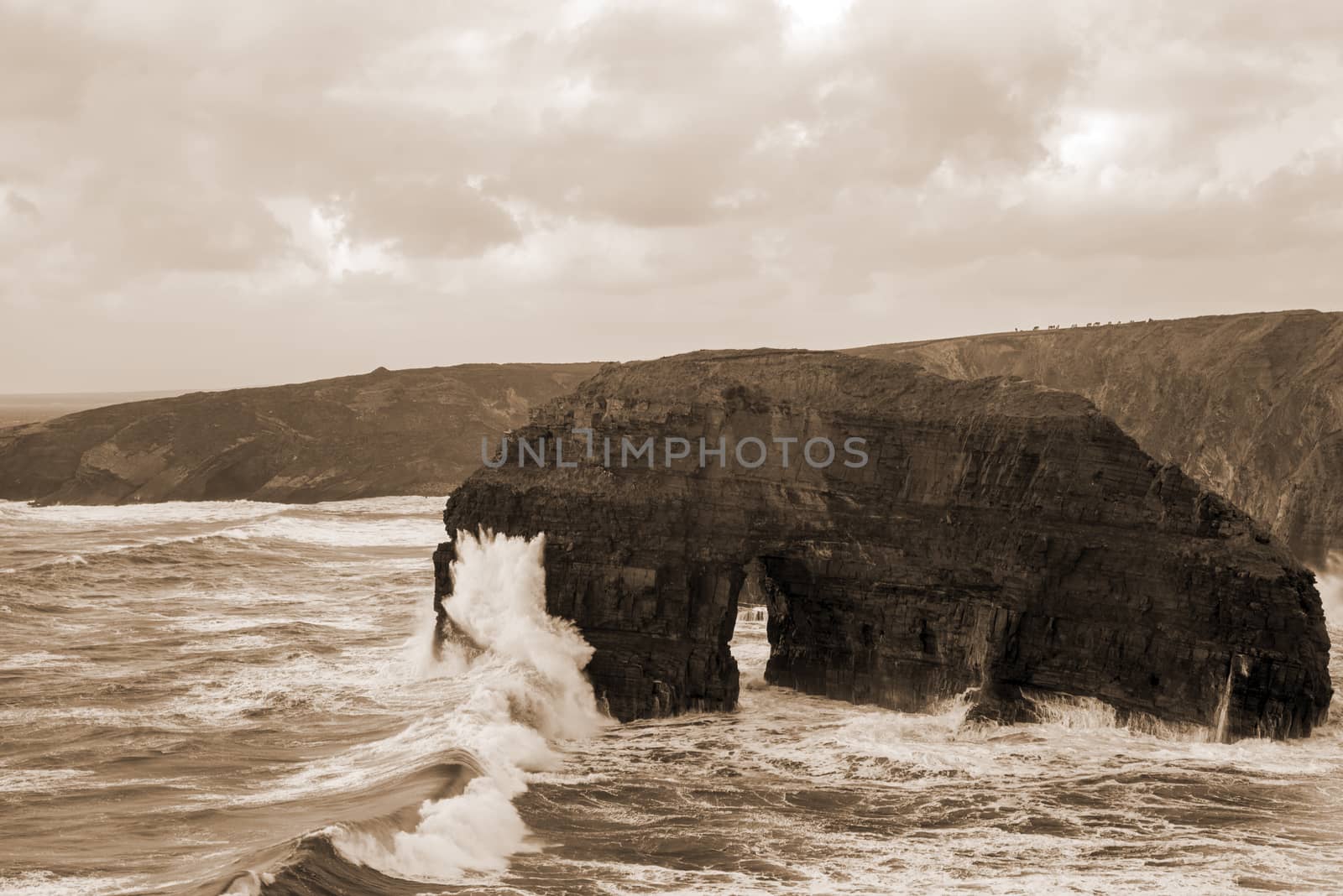 sepia virgin rocks with storm waves by morrbyte