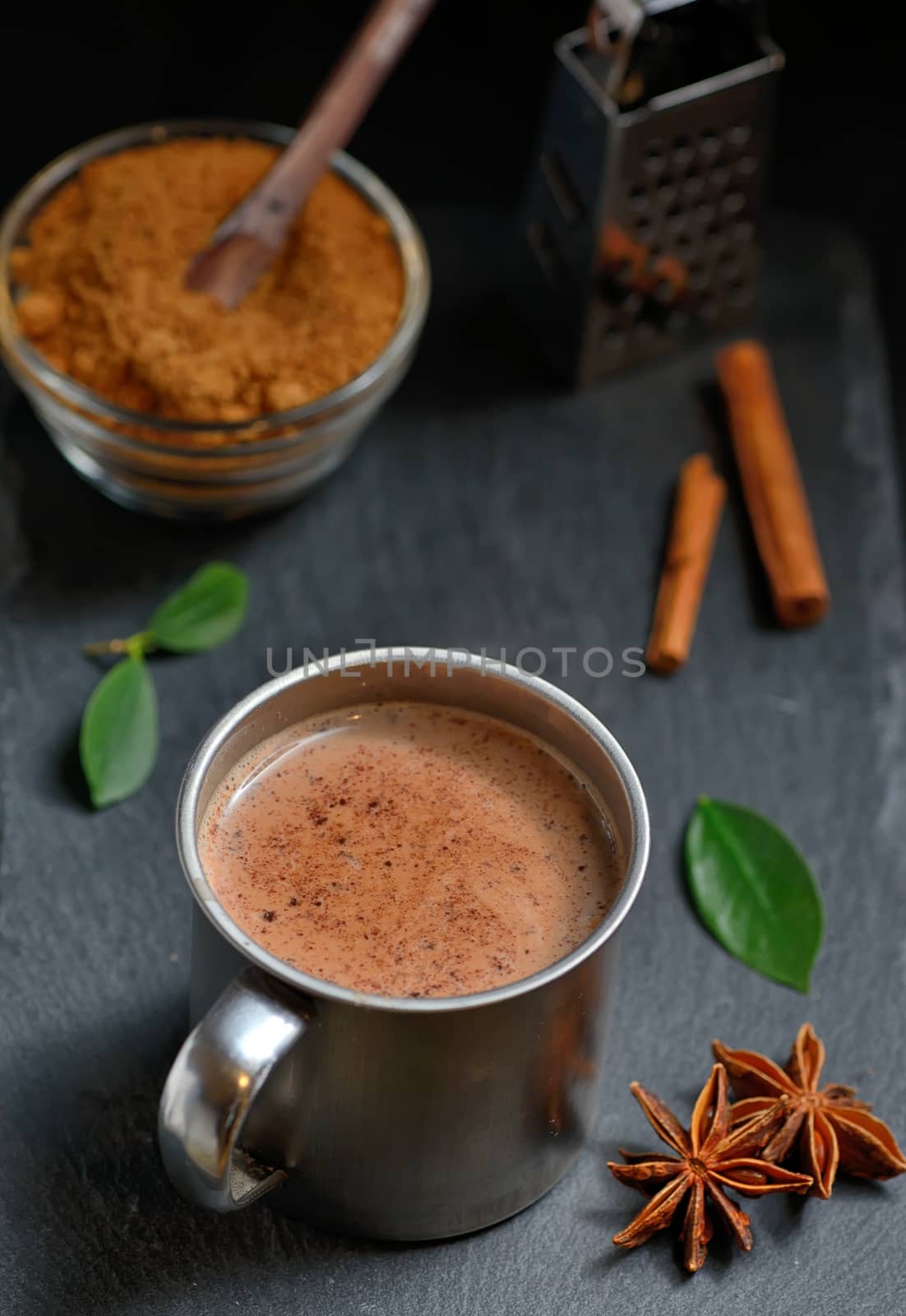 Cup of hot chocolate, cinnamon sticks and Coconut palm sugar