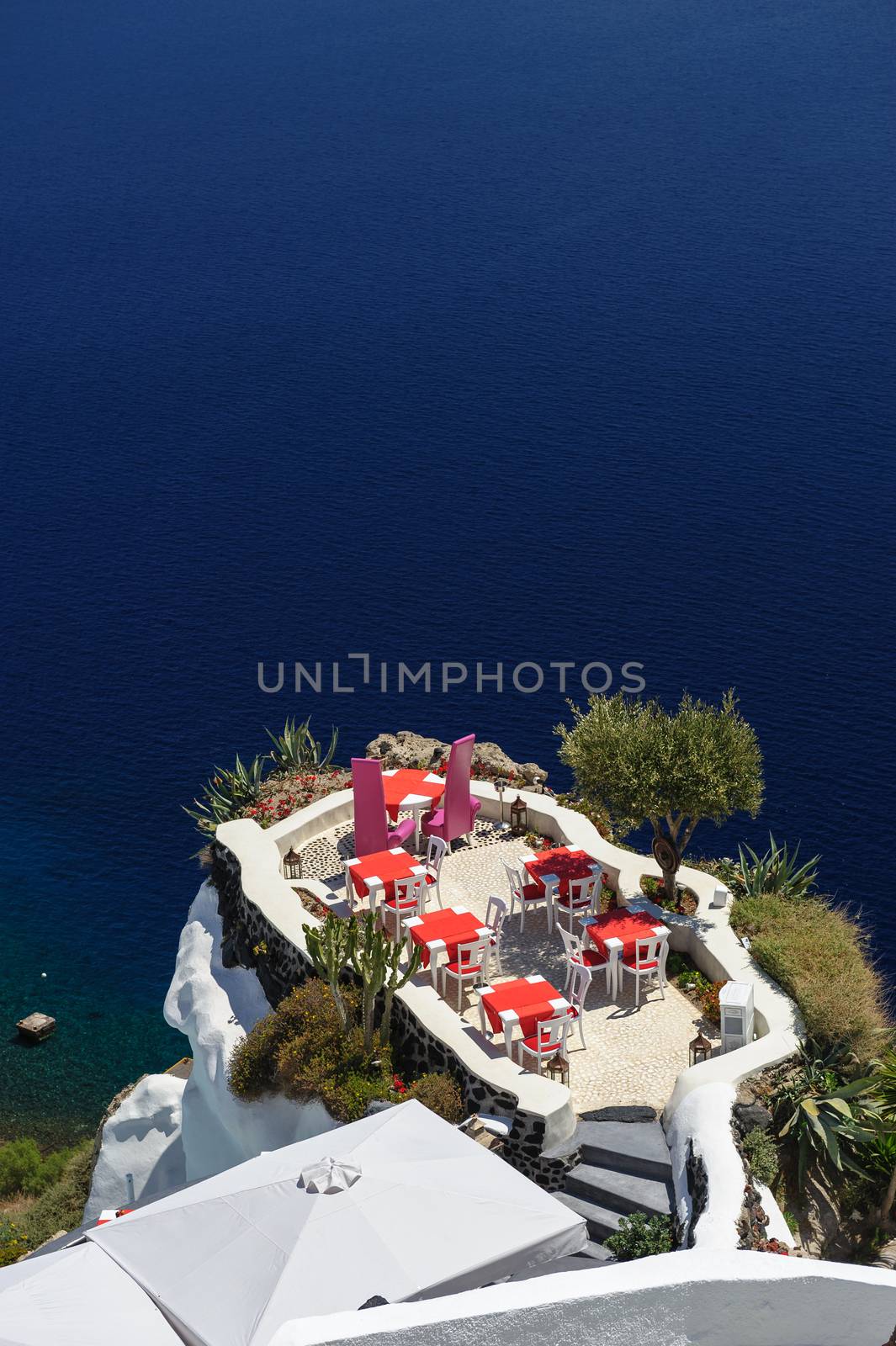 Luxury outdoor sea view cafe of Oia, Santorini, Greece. Lot of copyspace.