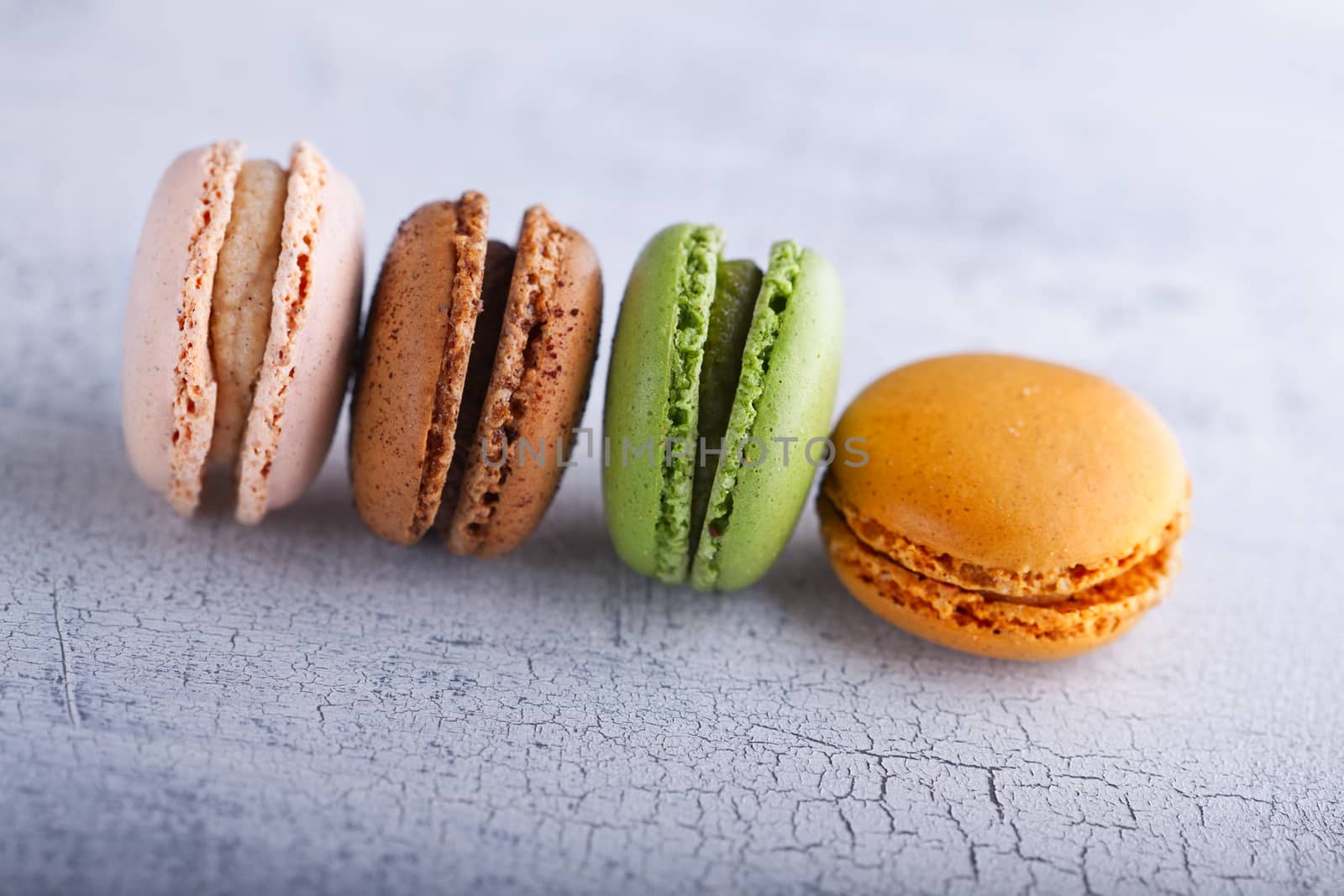 Set of colorful macaroons on a white plate