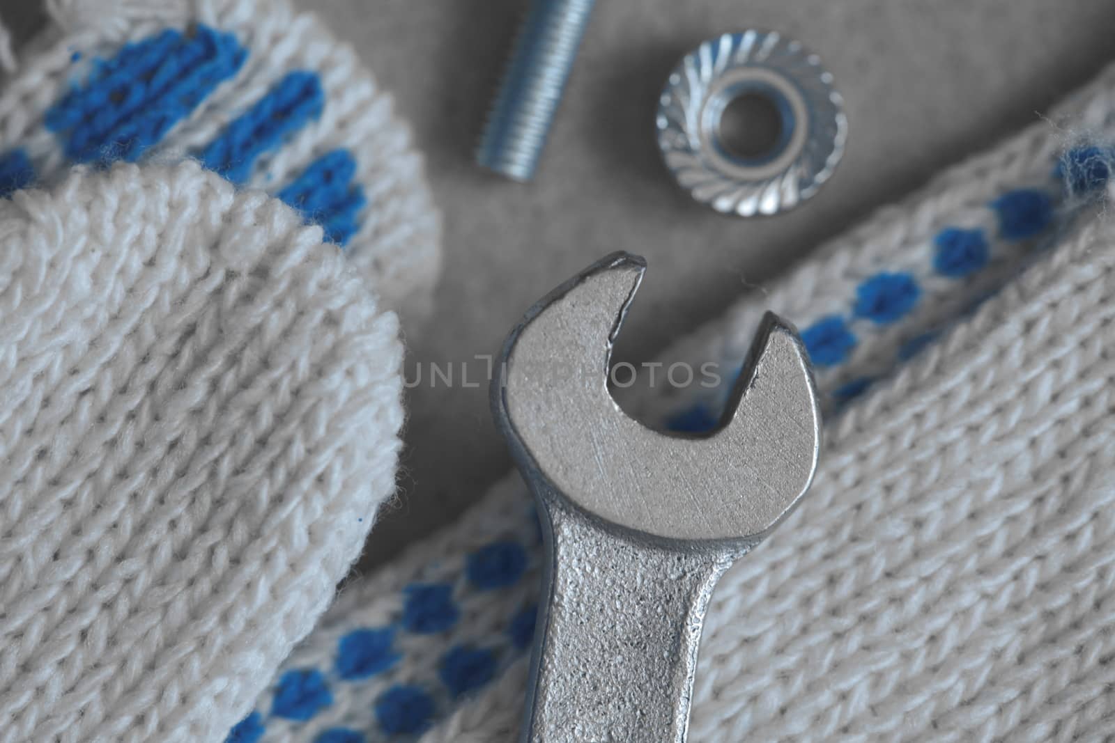 Work gloves and wrenches close up by mrivserg