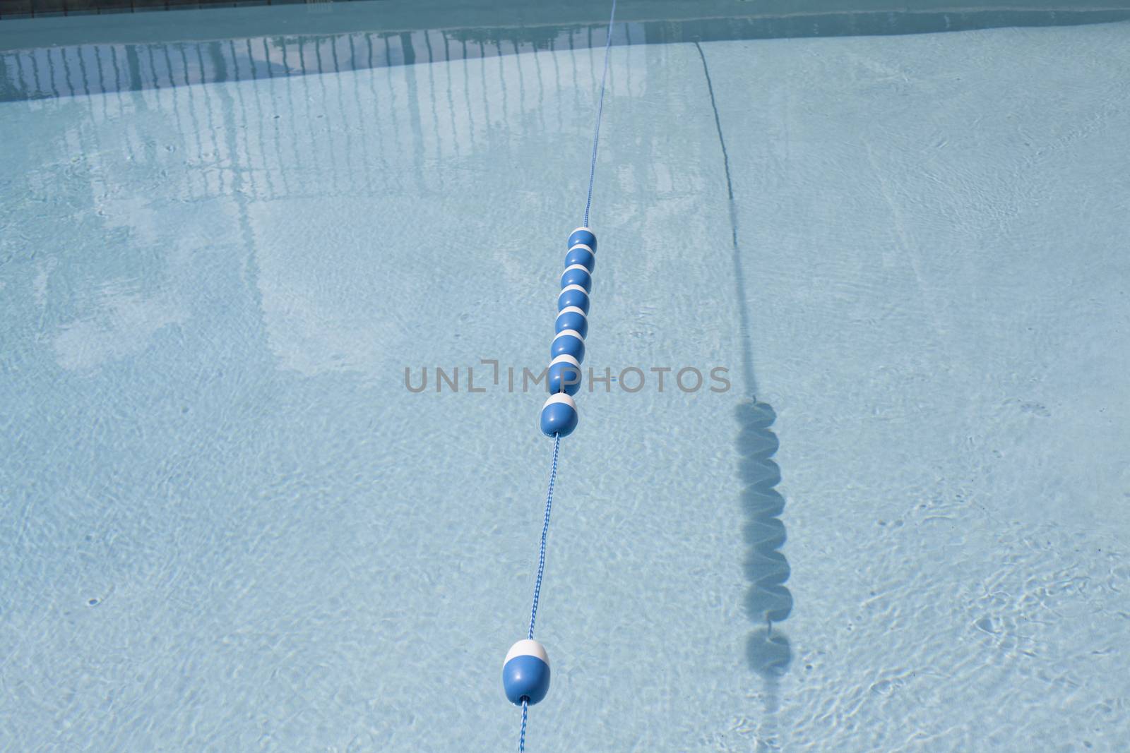 Dividing line between the shallow and deep ends of a clean swimming pool